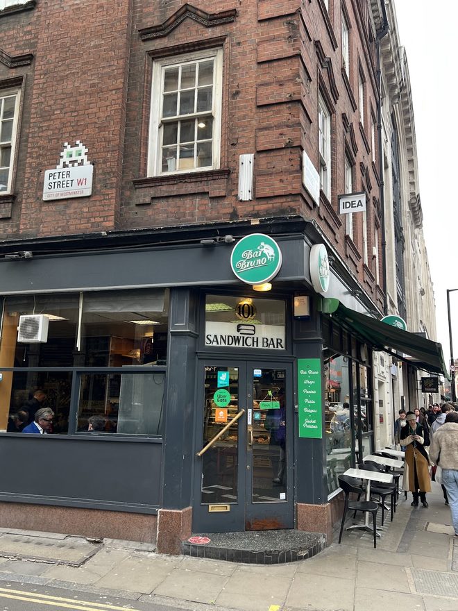 Bar Bruno seen from down the street, with pavement tables outside